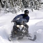 Learn how to Snowmobile on our Tours in Golden